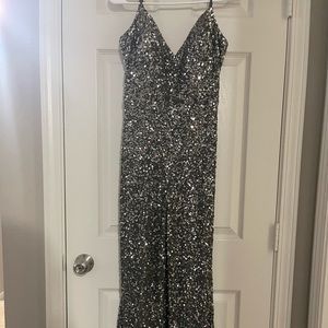 jumpsuit/pantsuit. gunmetal gray. covered in sequins. bootcut/flare bottom.